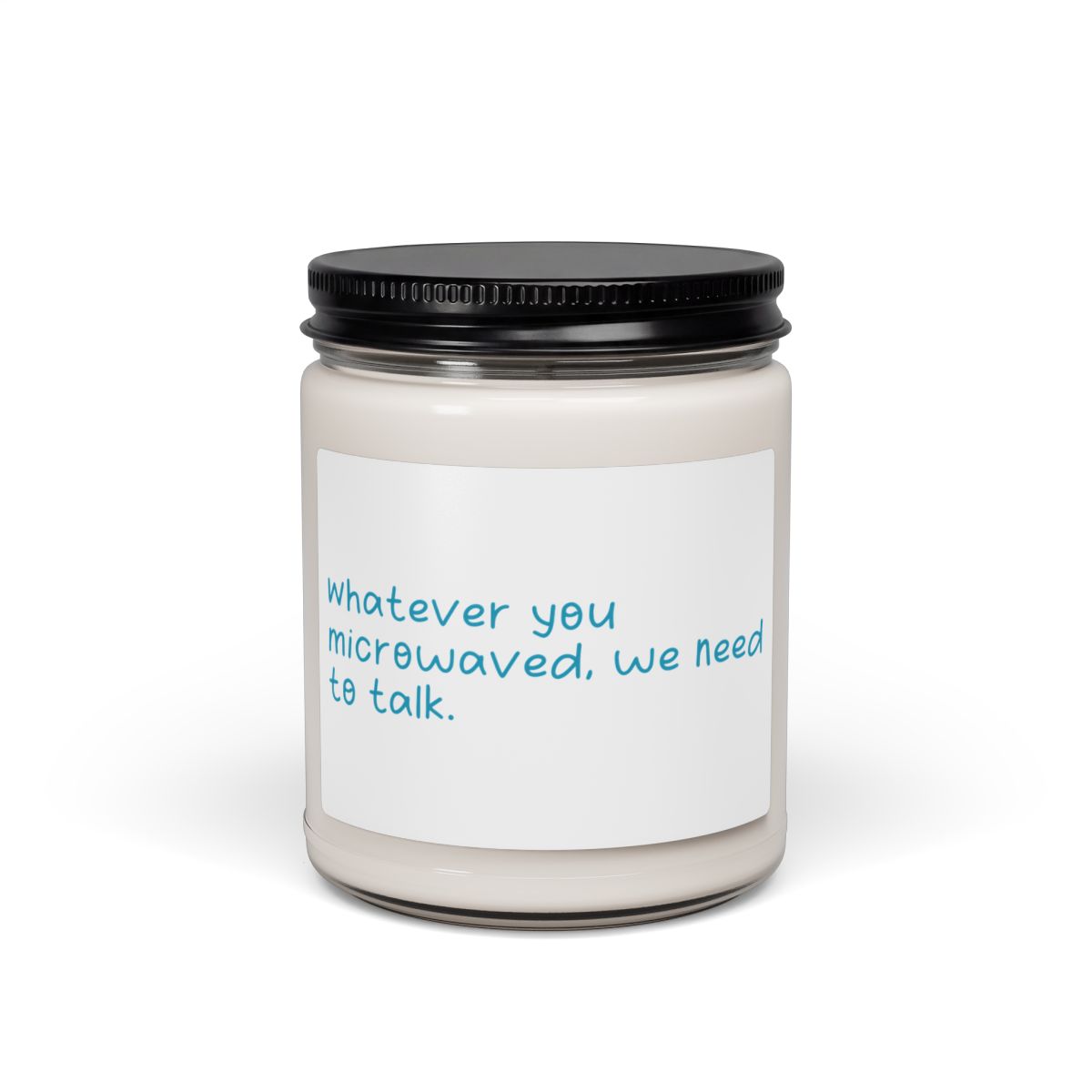 Scented candle labelled with the quote “Whatever you microwaved, we need to talk.”